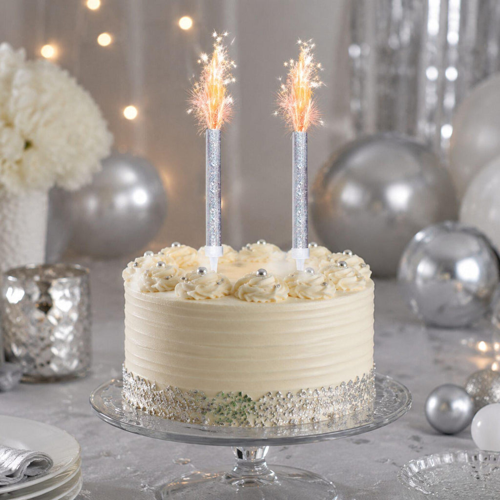 Silver celebration cake display with two sparkling ice fountain decorations