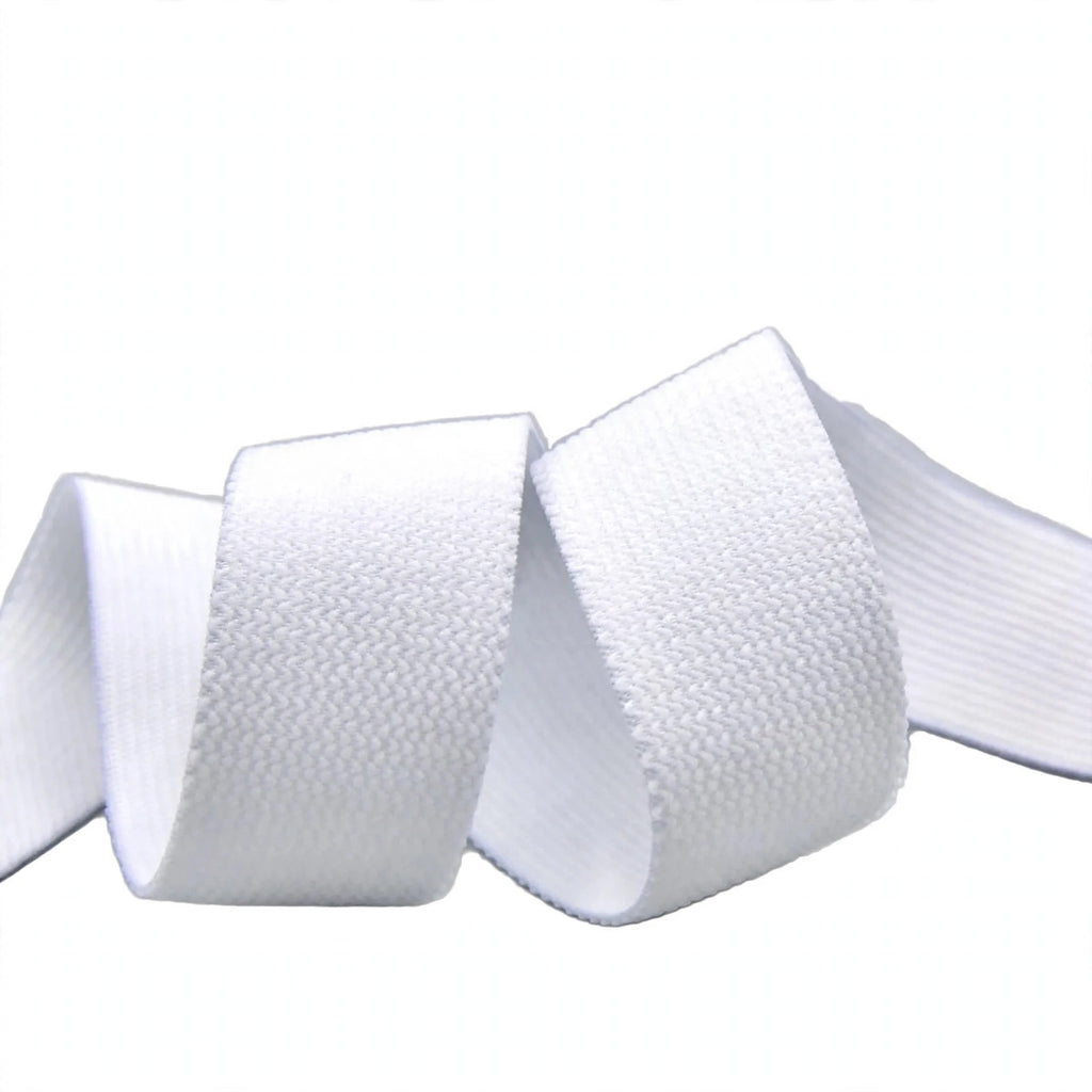 Close-up view of soft white flat elastic one inch wide
