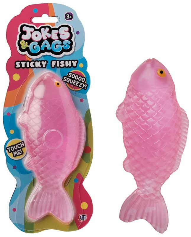 Squishy Sticky Icky Fishy pink novelty toy shown in packaging and out of packaging on white background