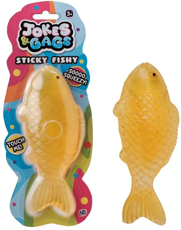Squishy Sticky Icky Fishy amber orange novelty toy shown in packaging and out of packaging on white background