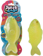 Squishy Sticky Icky Fishy lime yellow-green novelty toy shown in packaging and out of packaging on white background