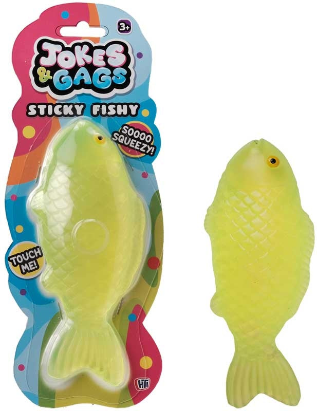 Squishy Sticky Icky Fishy lime yellow-green novelty toy shown in packaging and out of packaging on white background