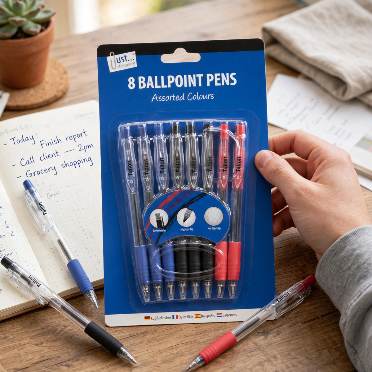 Tallon retractable rubber grip pen being used for writing at a desk