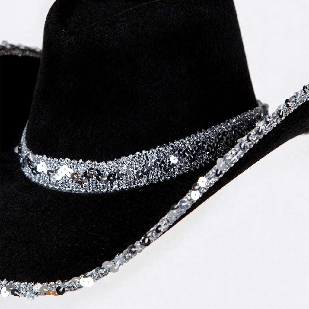 Close-up view of adults cowboy hat with silver sequins on black base
