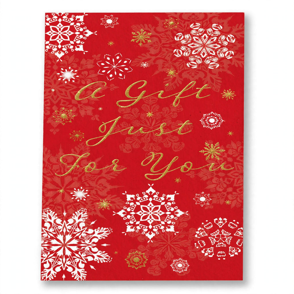 Close-up of traditional Christmas money envelope showing assorted design