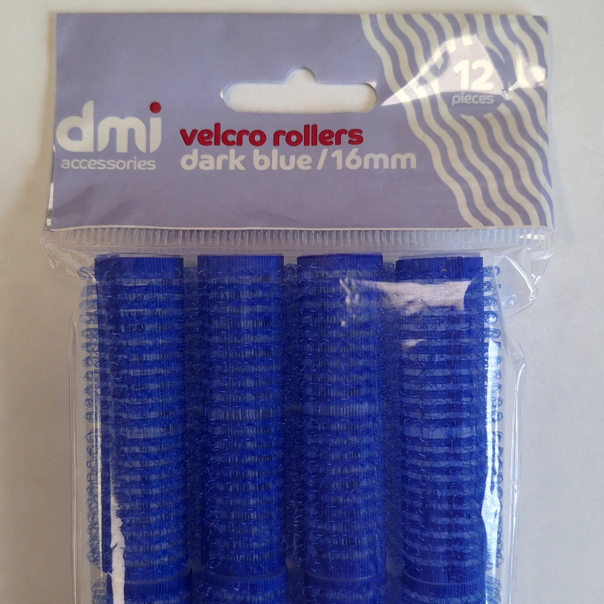 Close-up view of dark blue velcro hair roller showing texture and size