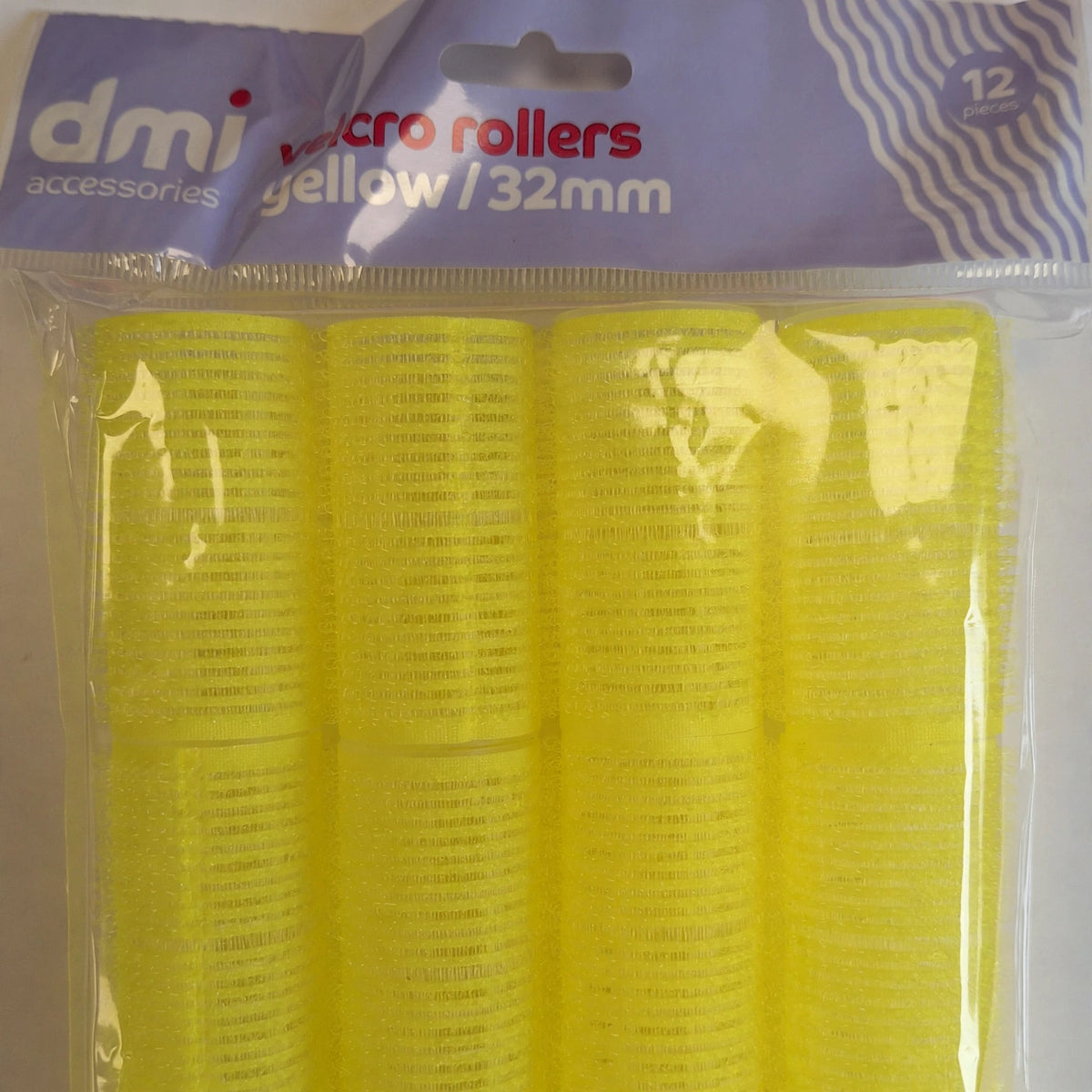Close-up view of yellow Velcro hair roller showing texture and size