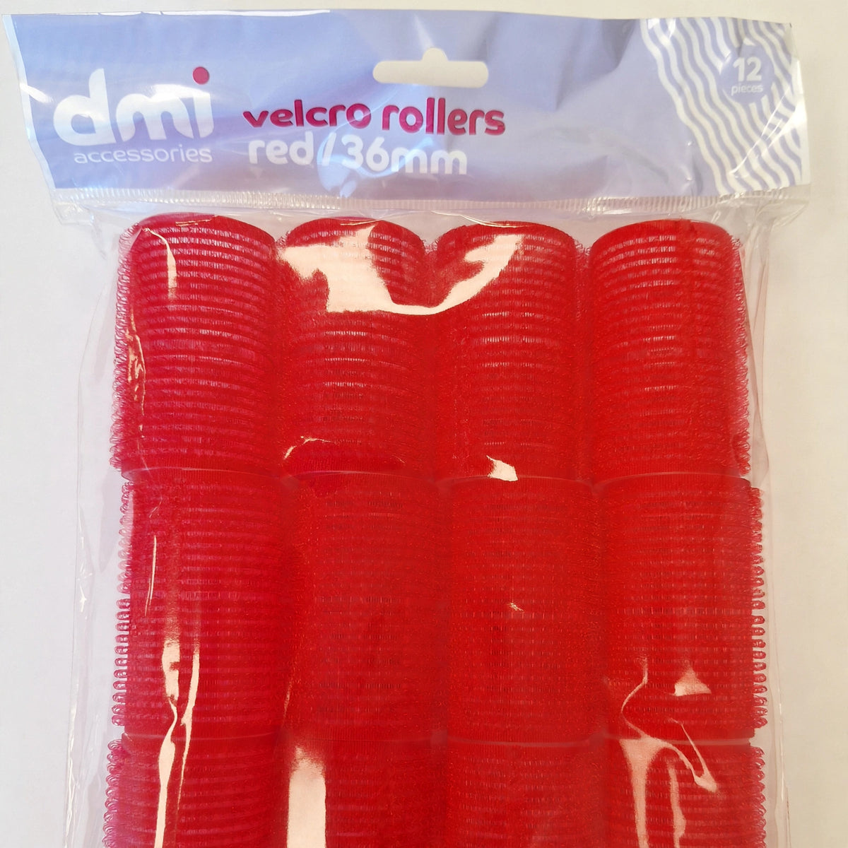 Close-up view of a red Velcro hair roller with 36mm diameter